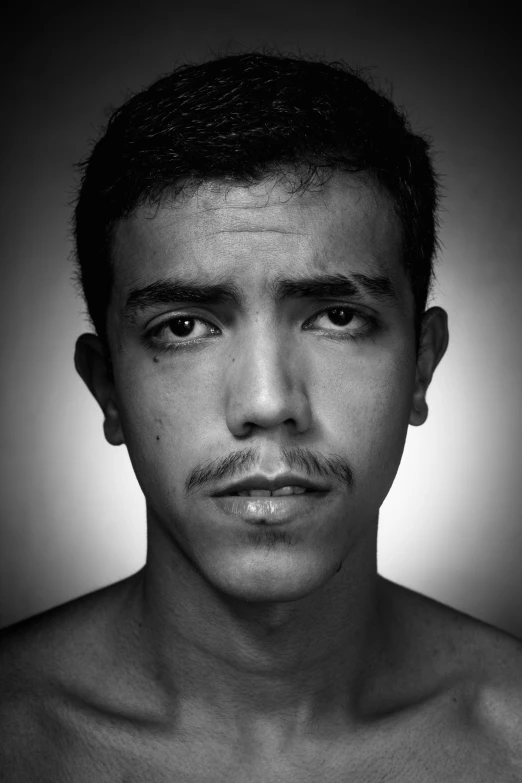 a black and white po of a man with a mustache