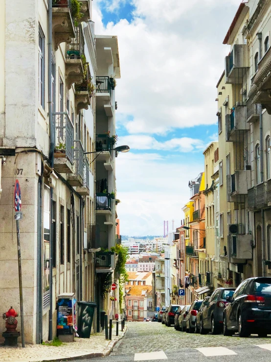 a narrow street with several buildings on both sides