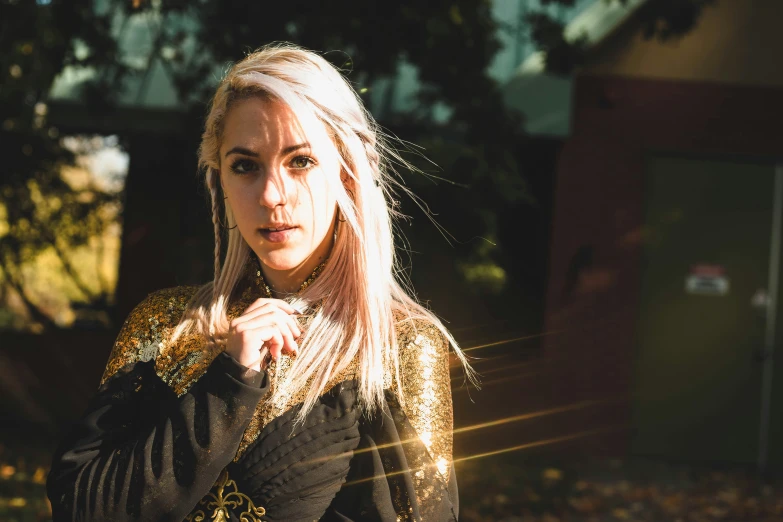 a blond woman posing on a sunny day