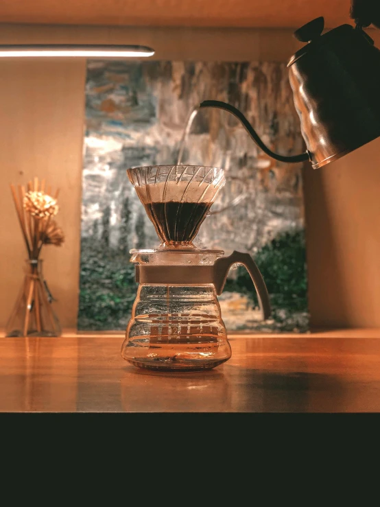 there is coffee in a cup sitting on the counter