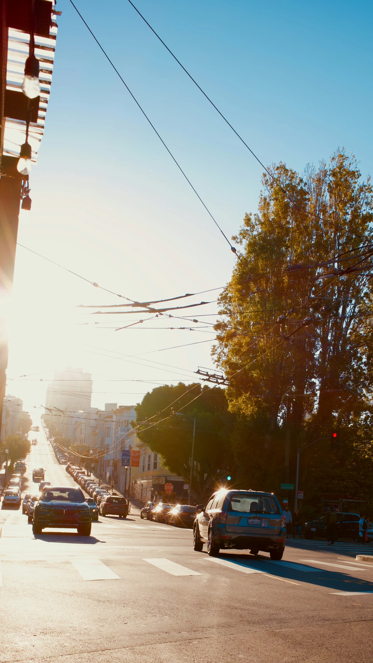 several cars are moving on an empty street