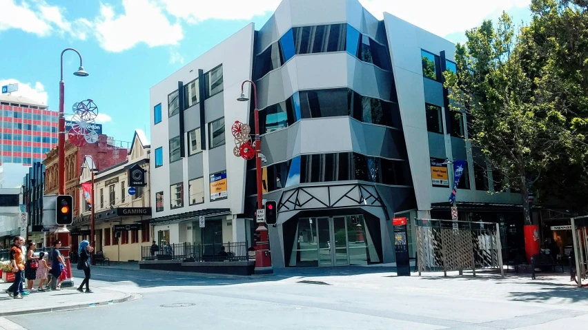 the building has many windows and is painted white