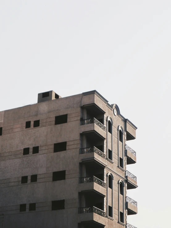 an apartment building with balconies is under construction