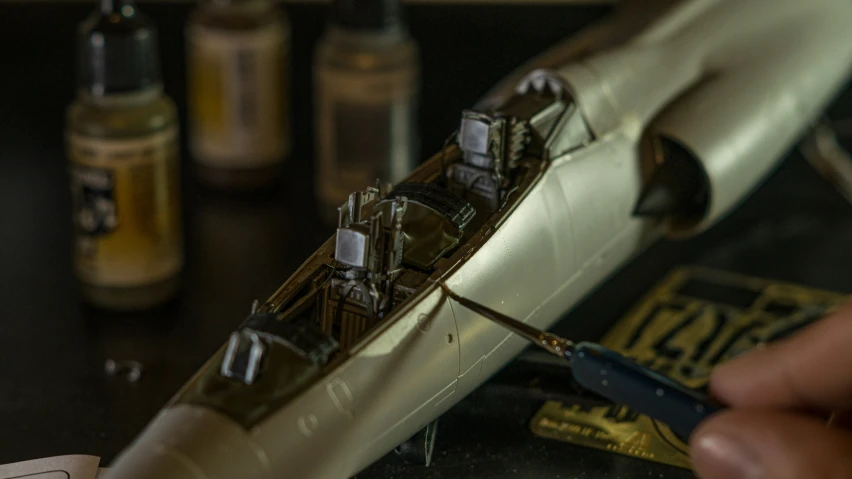 a miniature boat is sitting on a table