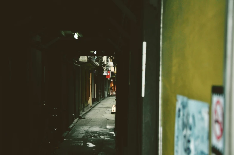 a dark alley that is full of signs on it