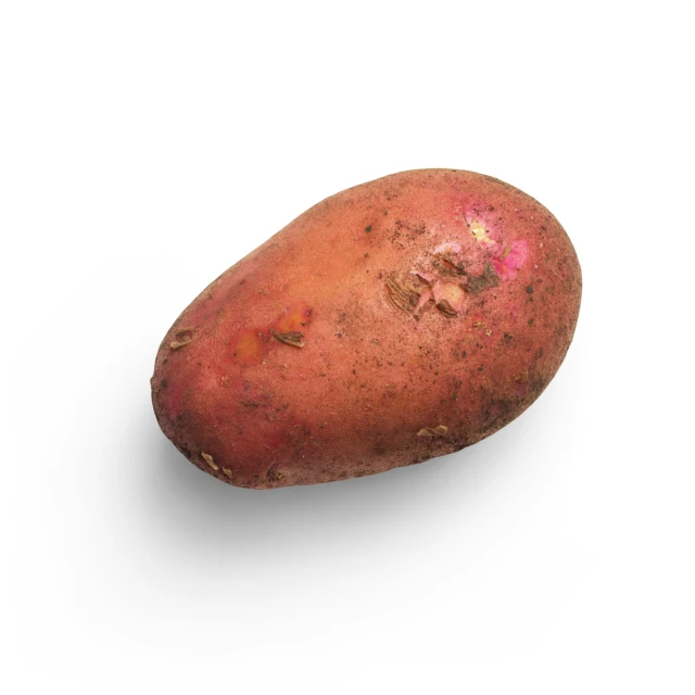 the image shows a pink potato with some brown spots