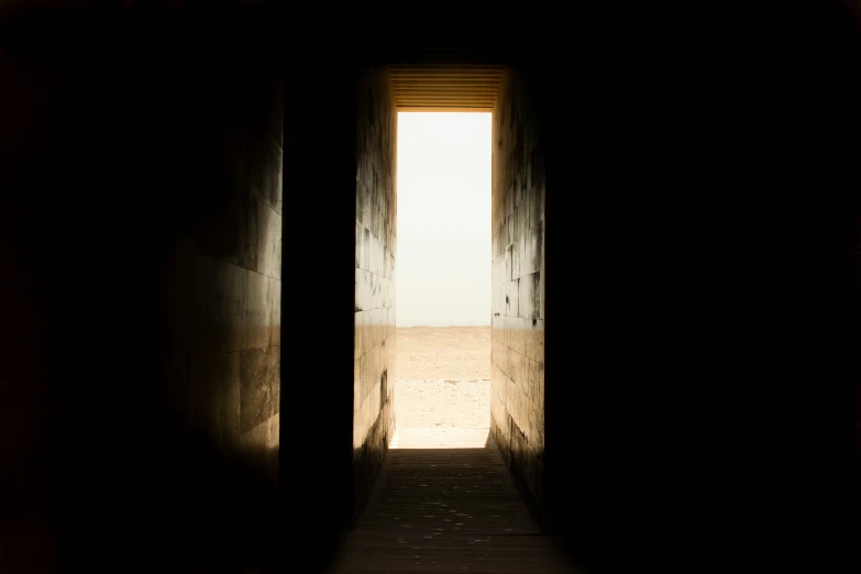 a long hallway leading to the open sky