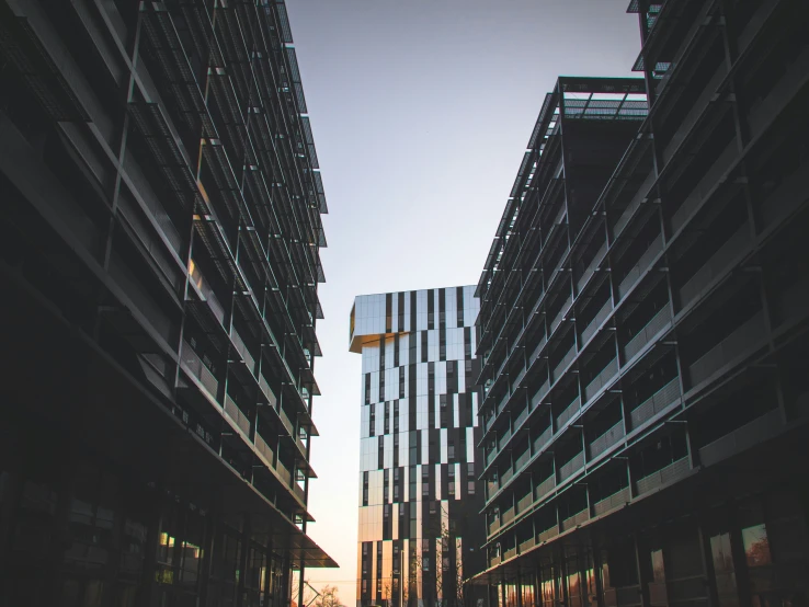 the view of two tall buildings of each building in the city