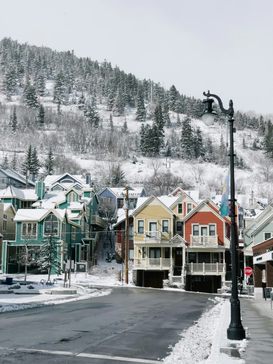 snow covered streets and houses are in a ski resort