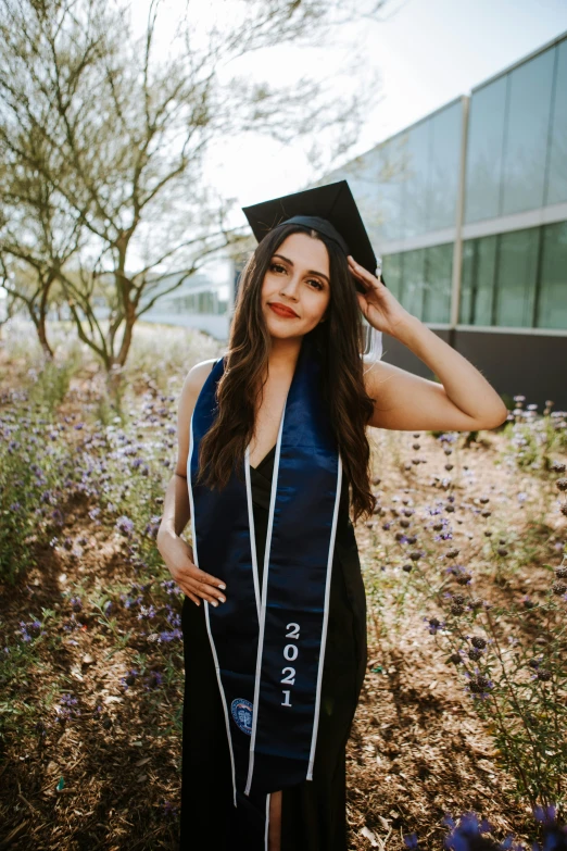 there is a woman wearing a cap and gown