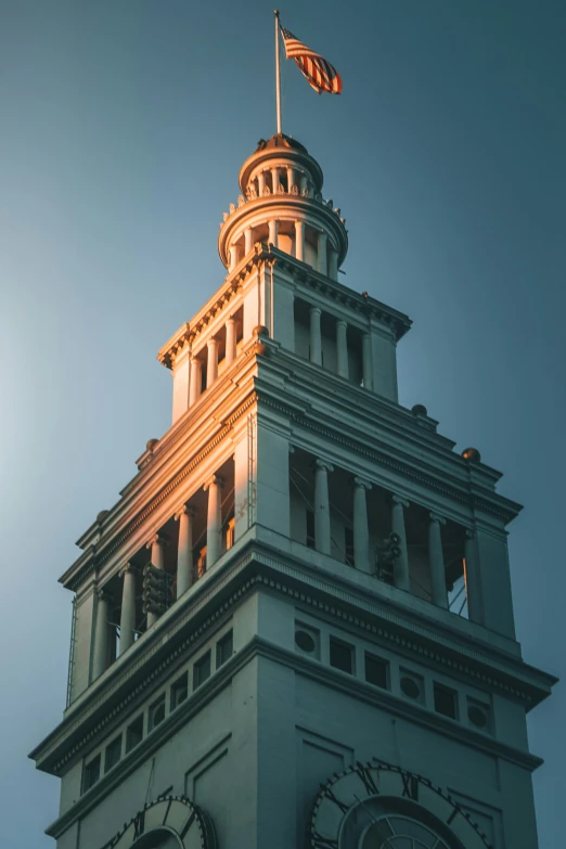 the sun shines through clouds on a clock tower