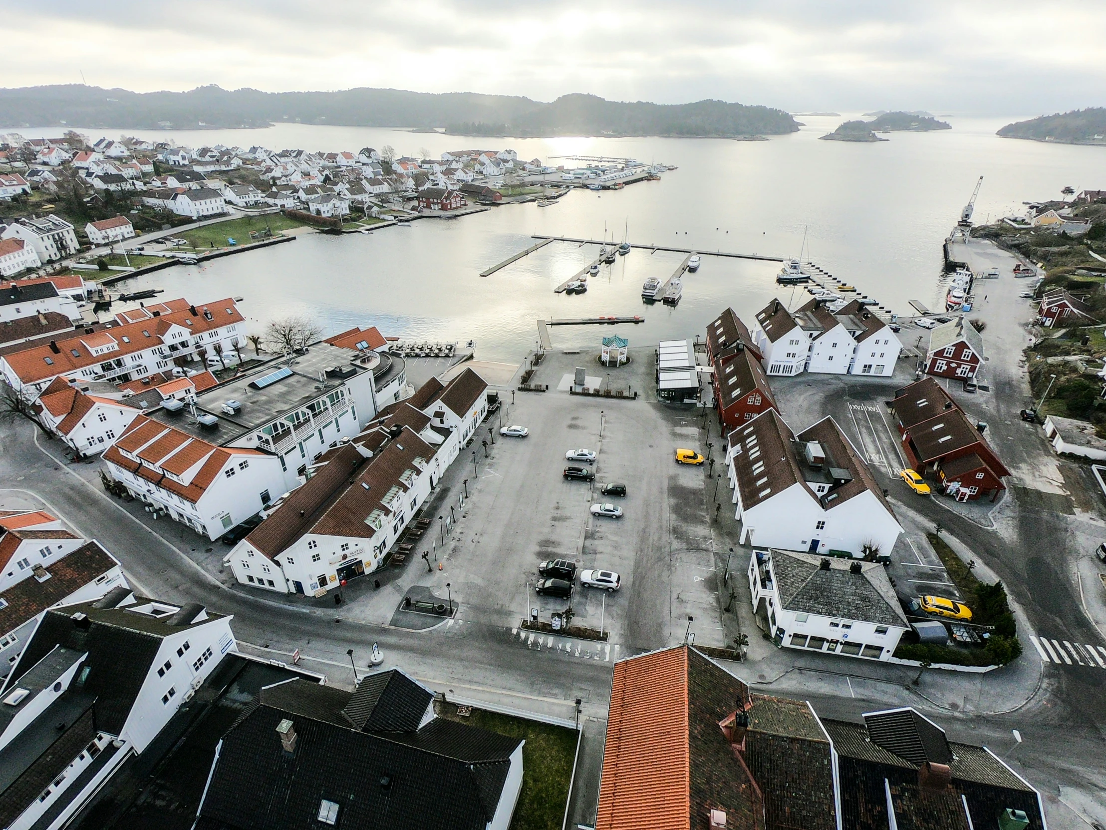 a large body of water next to small houses