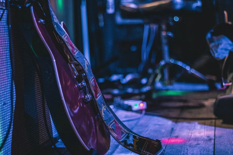 a picture of some guitars in a room