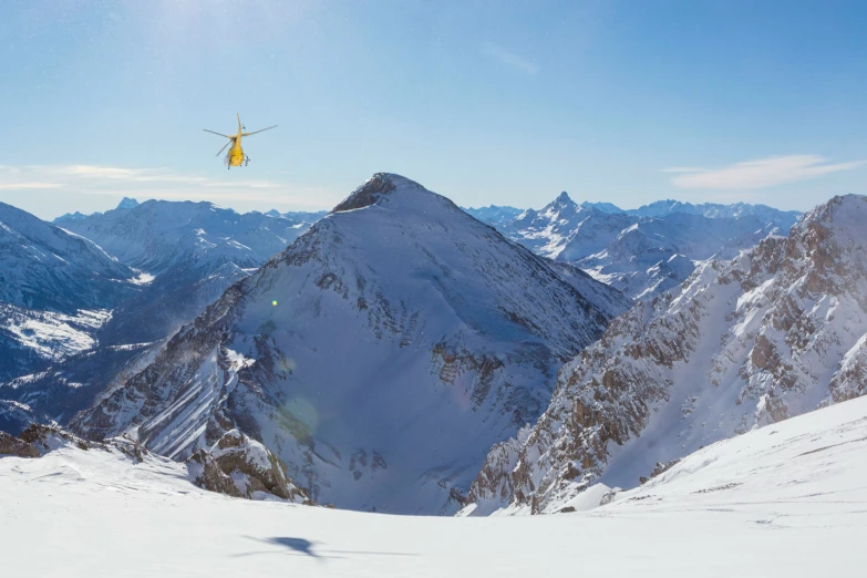 a person on skis does a jump off of a mountain