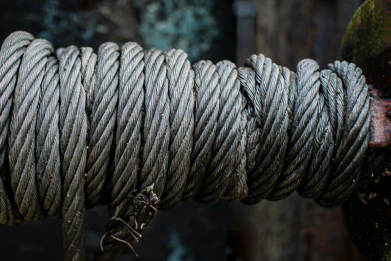 close up s of a twisted rope with chains