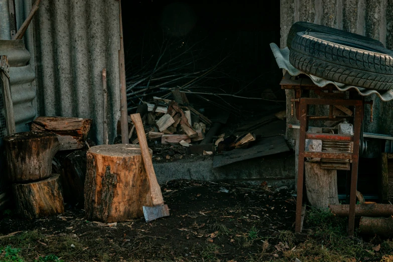 a fire place with some wood near by