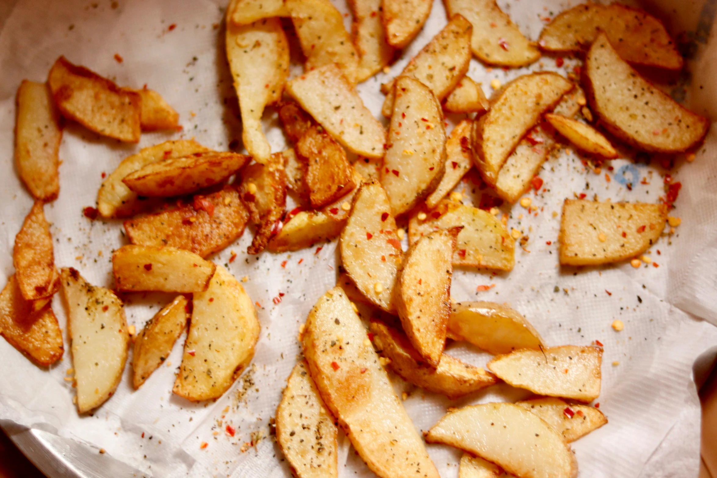 some fried apples sit on a tray and are ready to be eaten