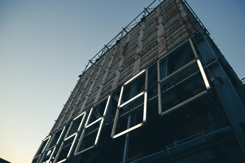 a tall building with steel bars on the top and one side