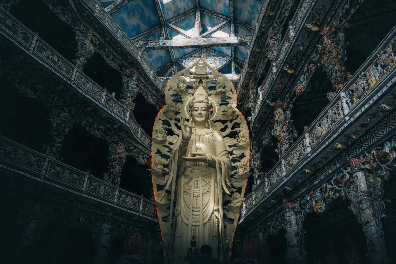 the large buddha statue is in the middle of the hallway