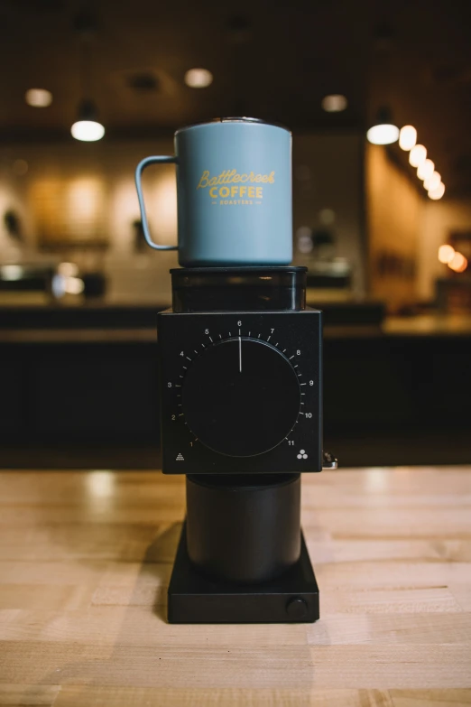 a coffee cup is sitting on top of a machine