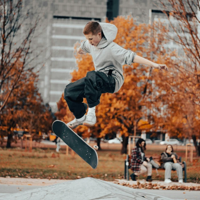 a young man riding a skateboard through the air