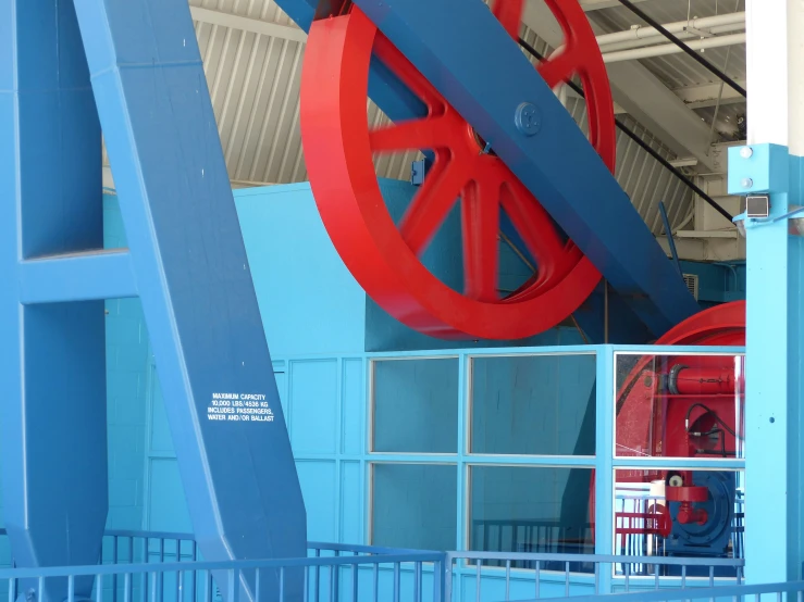 a giant wheel inside a building in a parking lot