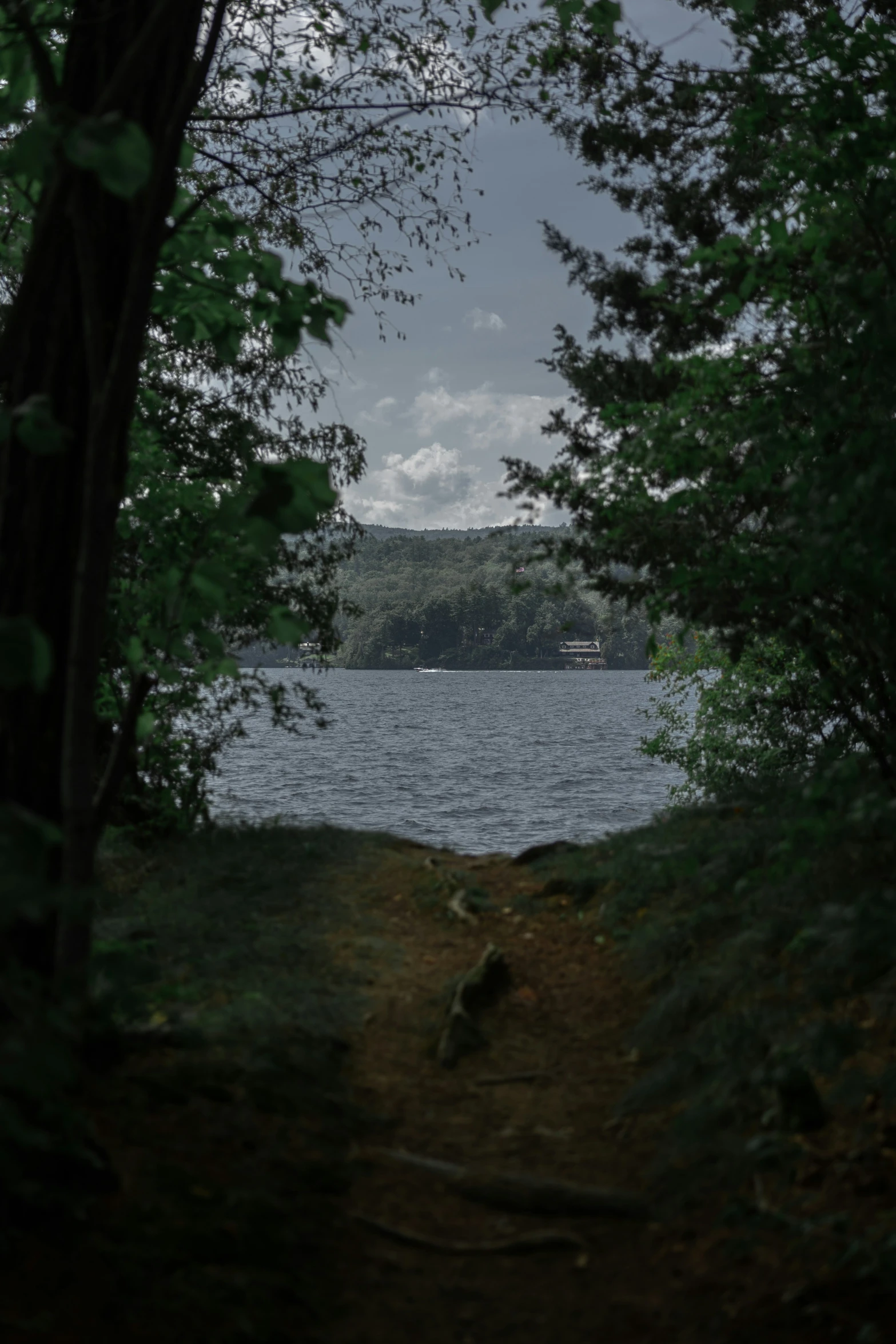 an image of a lake with mountains and water in the background