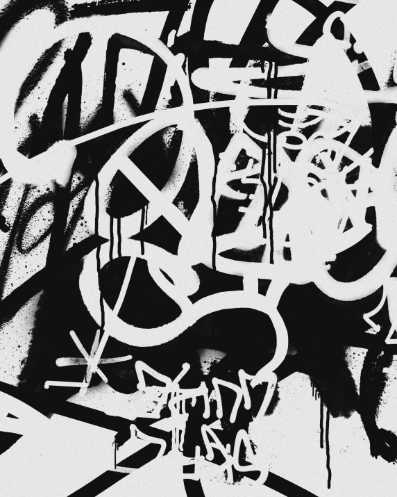 black and white graffiti in the middle of the frame