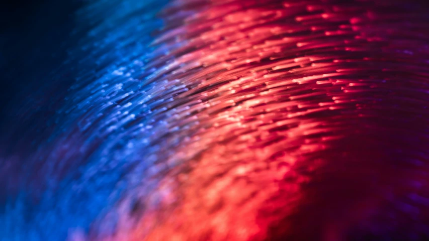 a close up of a background with colors like blue and red