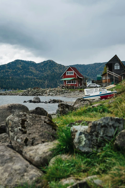 the house sits on a cliff near the water