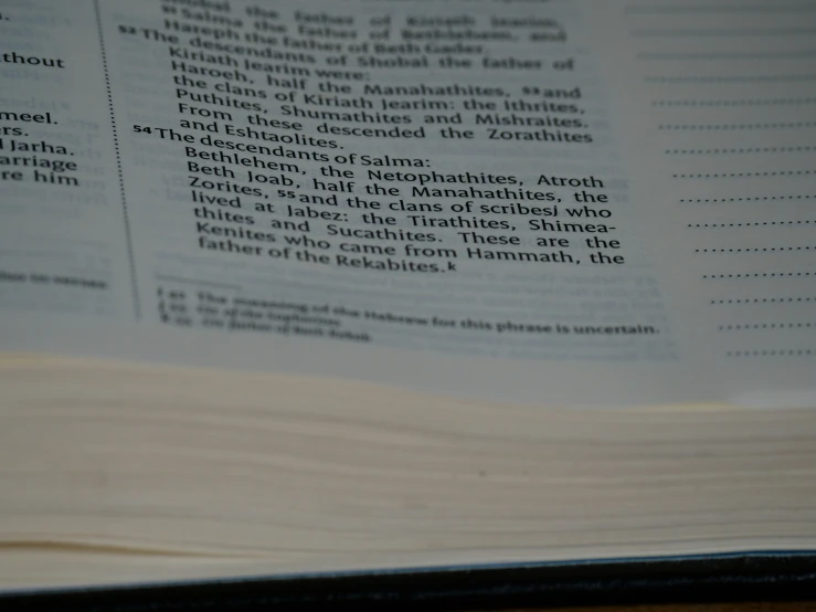a close up of a book containing text on a table