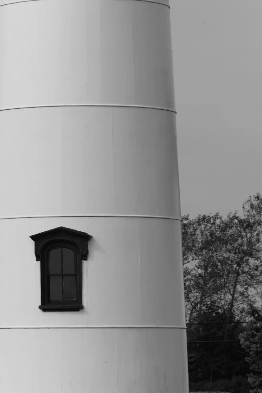 an image of a lighthouse building with the light turned on