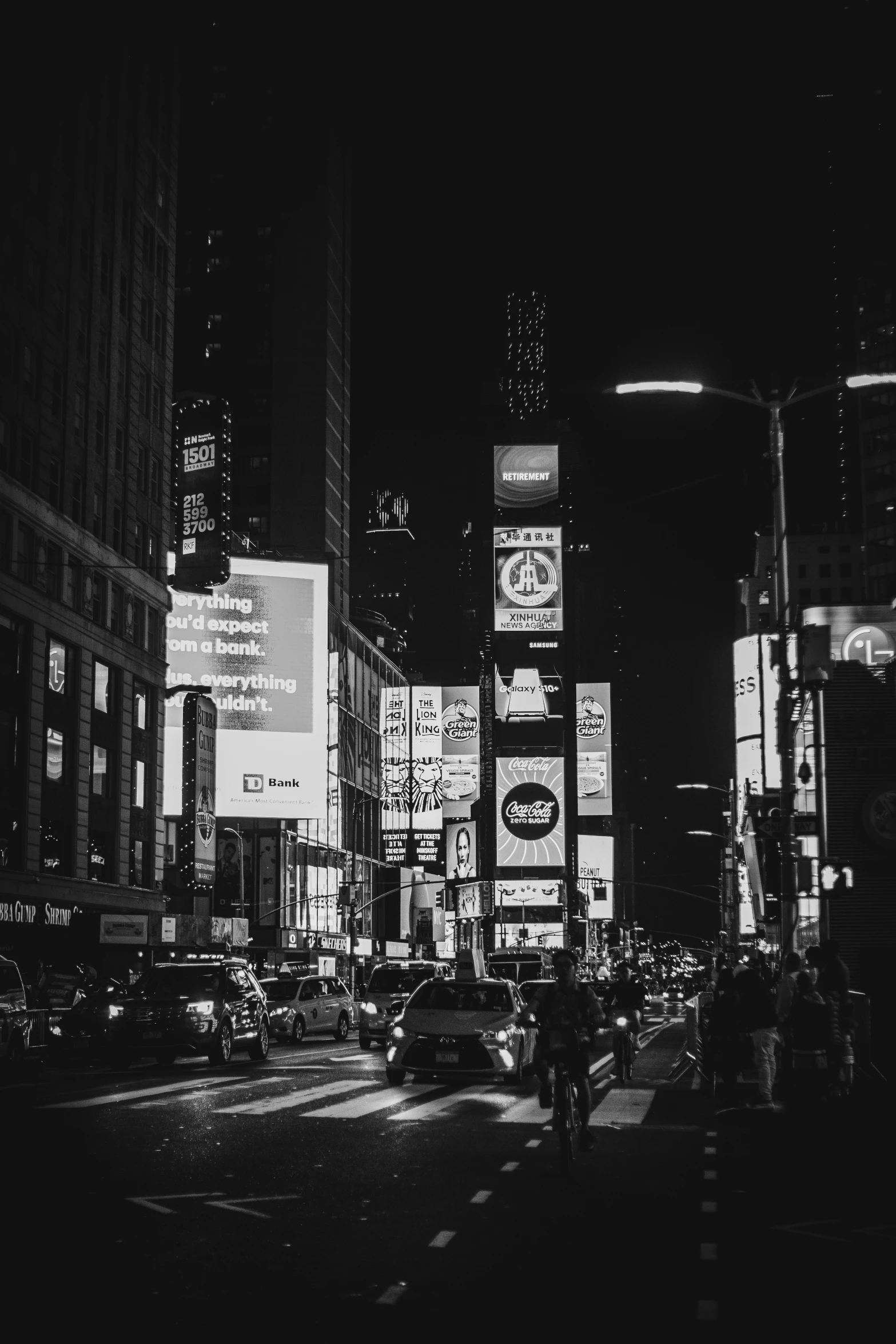 a busy city street filled with lots of tall buildings