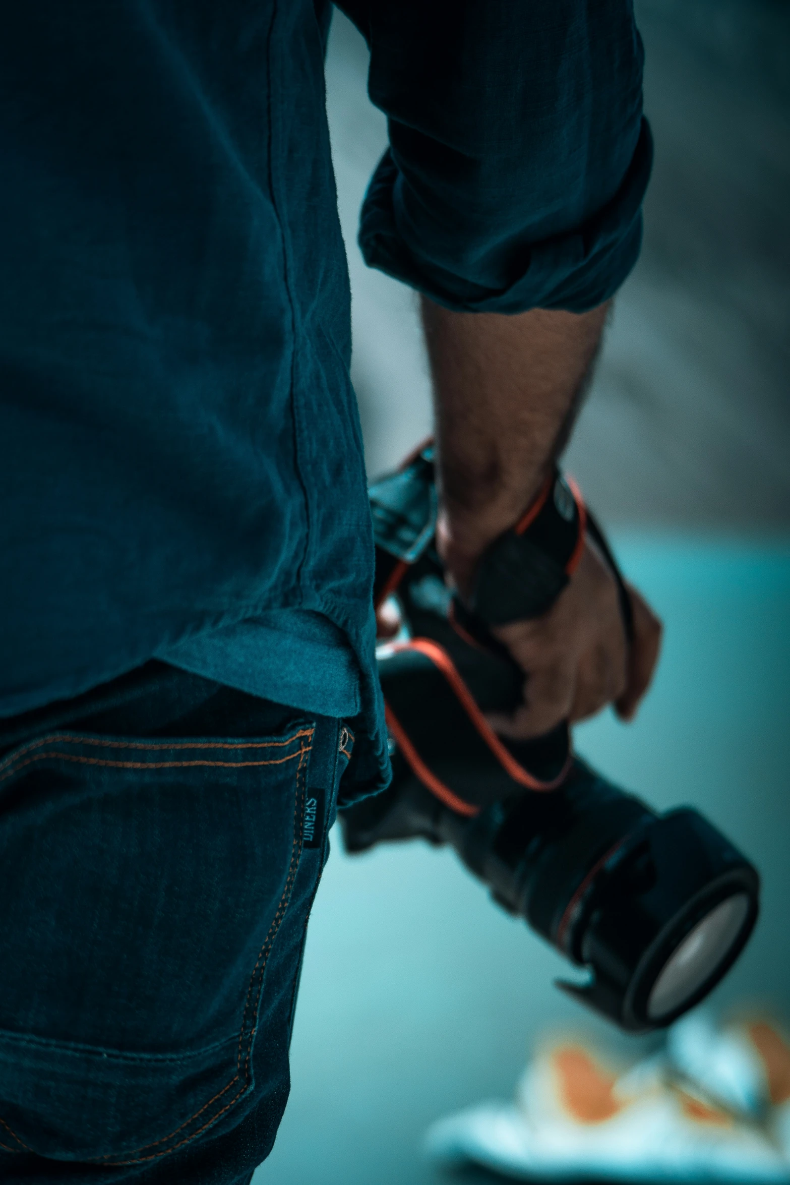 the hands of two people who are holding a camera