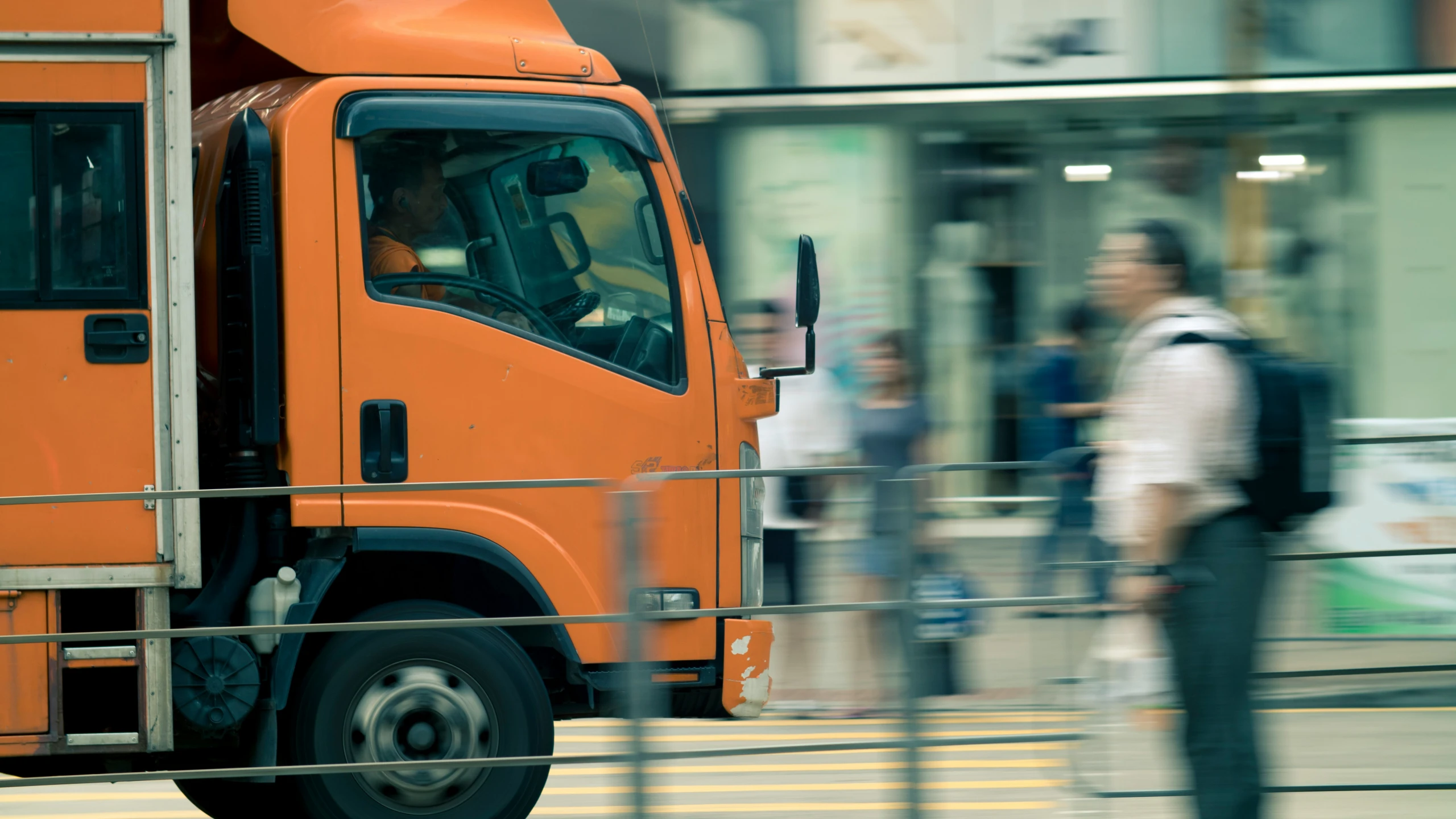 there is a large truck that is being driven by people