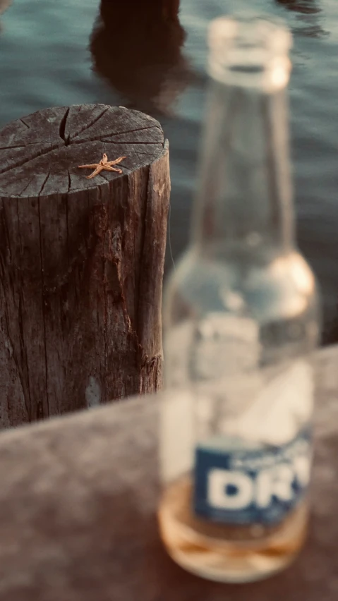 a bottle that has a dragonfly on it