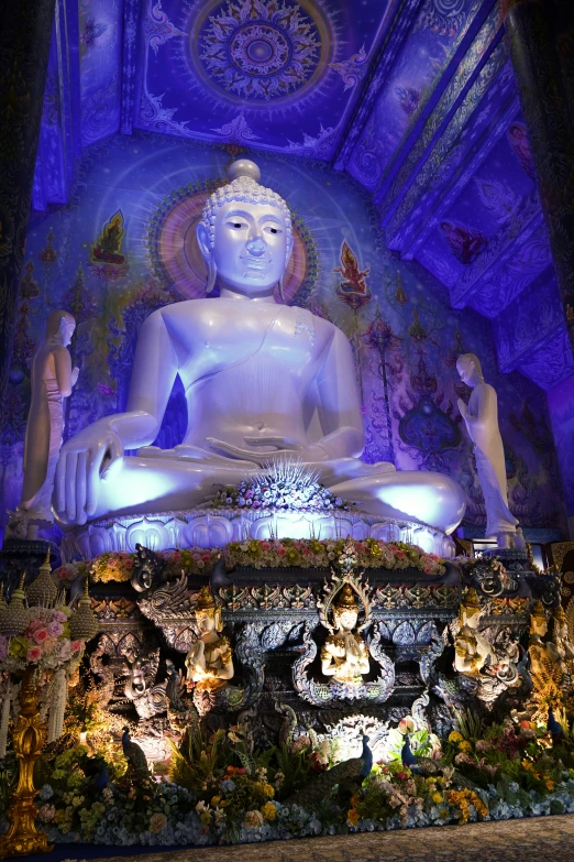 a large statue on top of a stone ledge