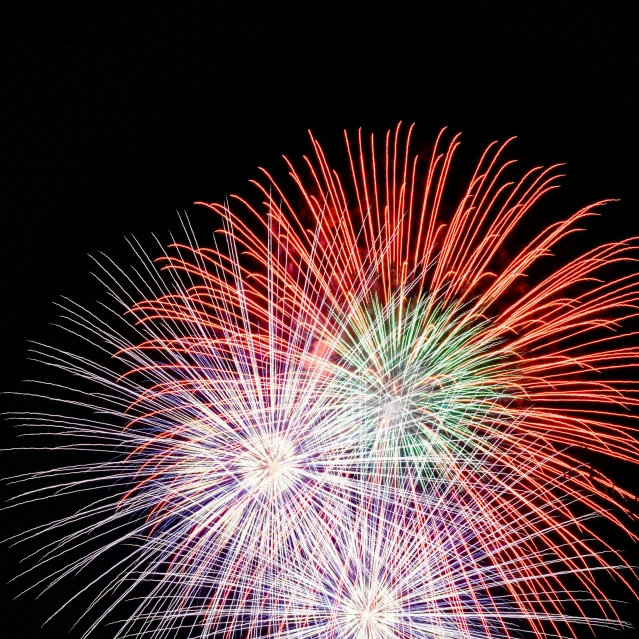 a large fireworks on the sky in the dark