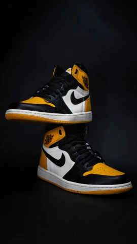 pair of yellow and black shoes in studio