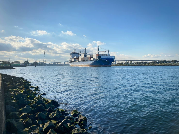 a blue ship sitting on top of the water