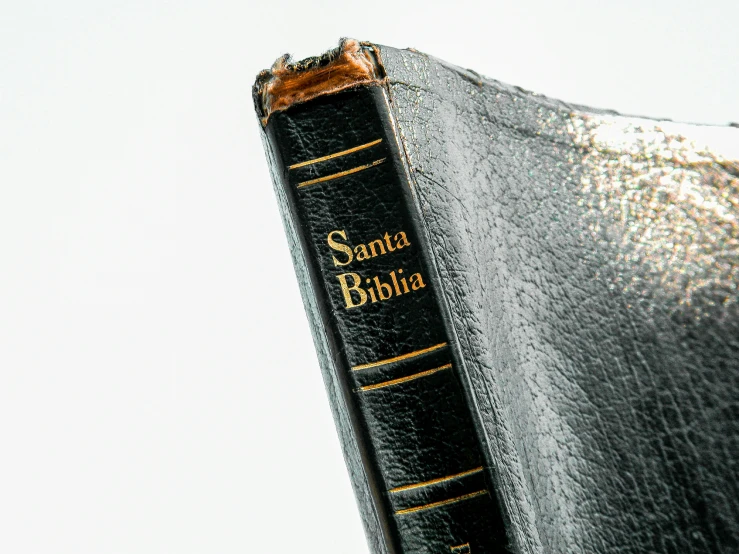 a closeup of a black book on top of a white book