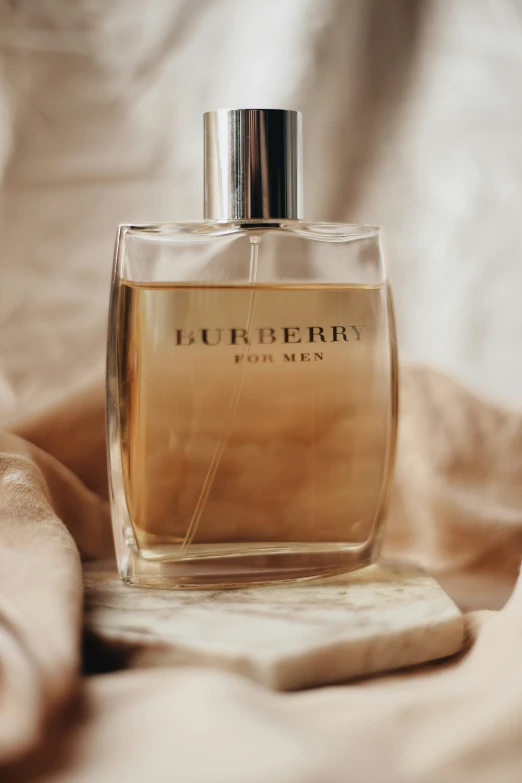 a bottle of burbery for men on a cloth