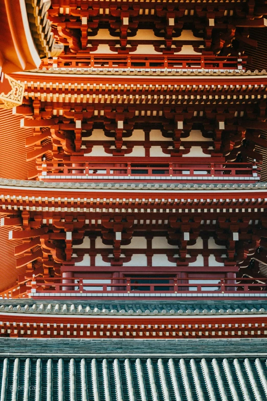 a view through the top of some tall asian temples
