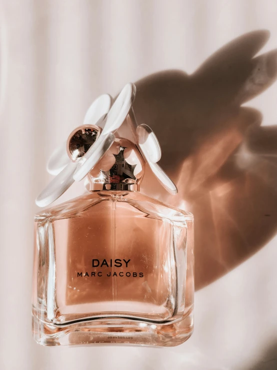 a small bottle of perfume is shown in this po