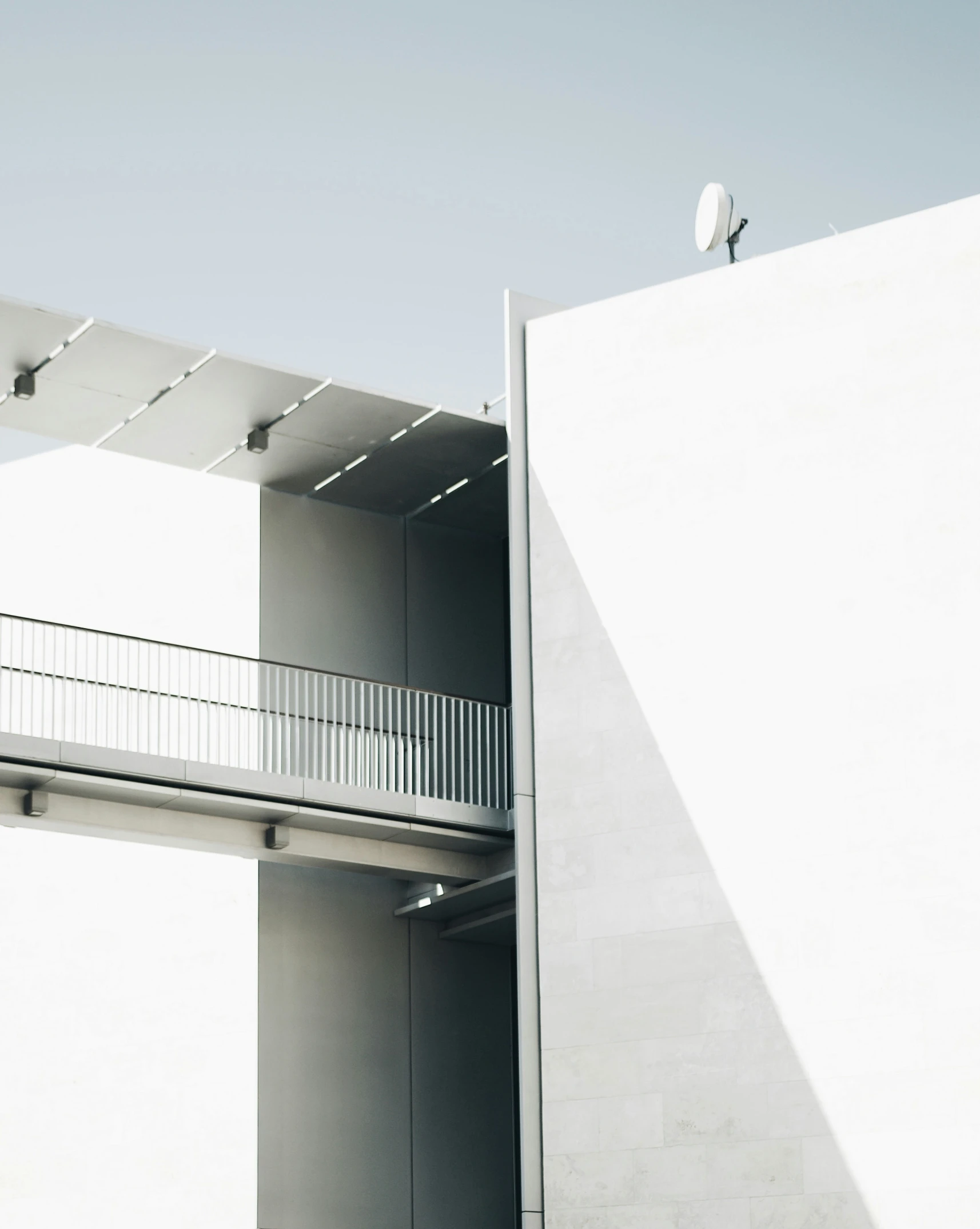 a bird perched on top of a white building