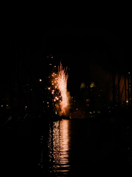 a firework with bright lights in the dark sky