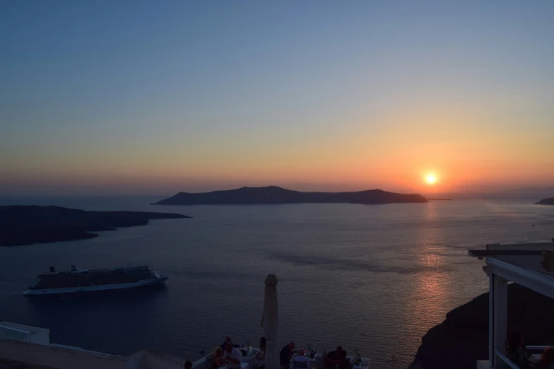 sunset view over the sea with cruise ship in background