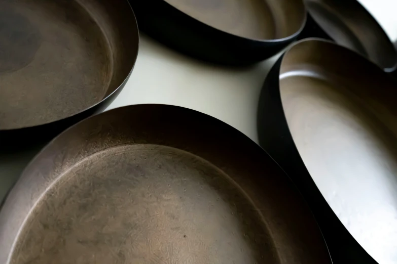 a set of five serving dishes sitting on top of a table