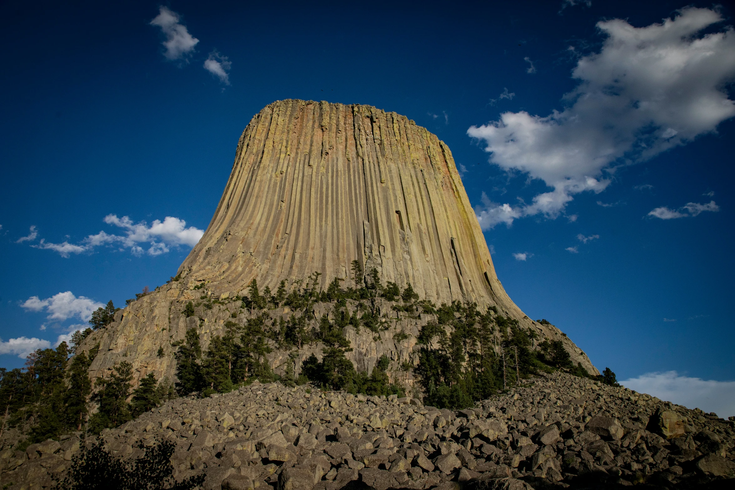 a large rock formation that is against a blue sky