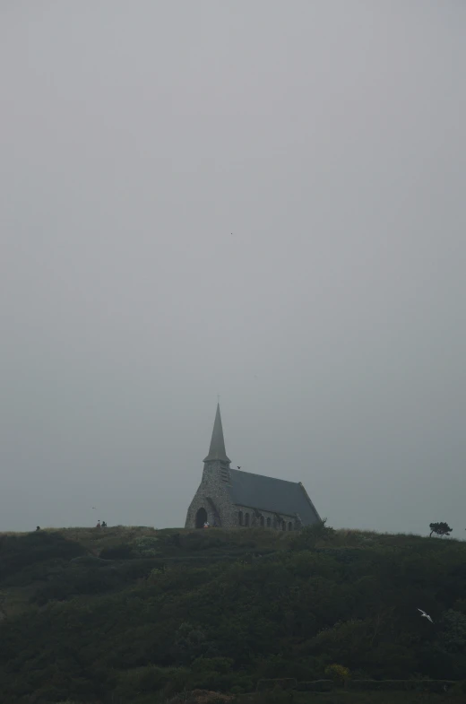a hill with a church on top of it